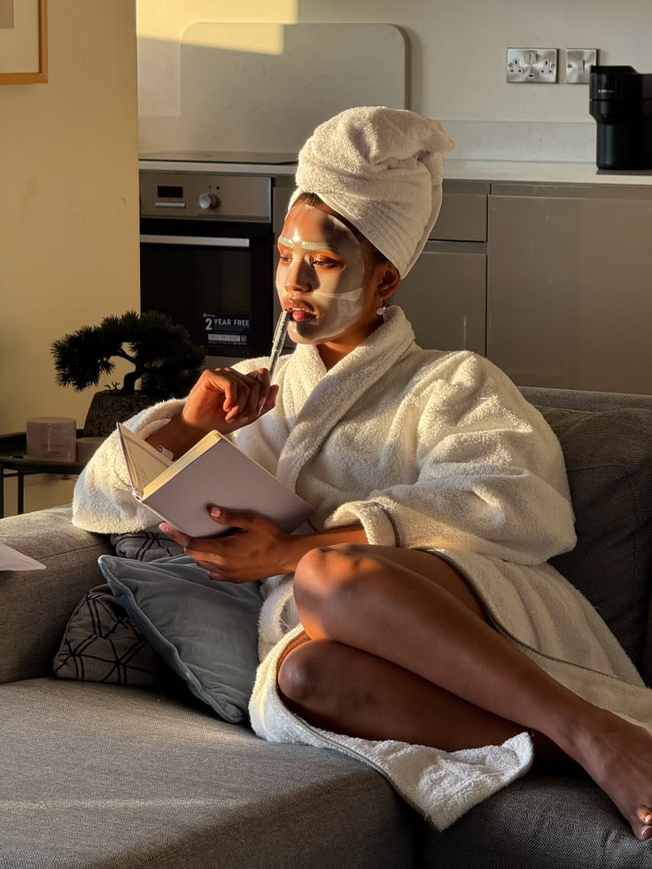 Woman in a robe taking a quiet moment for her skincare ritual